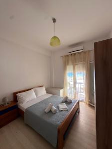 a bedroom with a bed with two towels on it at Sea View Studios, Harbour Beach, Bali in Bali