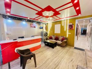 a living room with a bar and a couch at Hotel Shreeji Palace - OPP Hanuman Garhi Mandir in Ayodhya