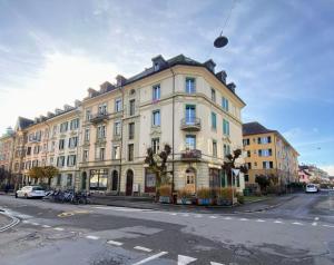 a large building on the side of a street at Flat 12-min walk to Bern station in Bern