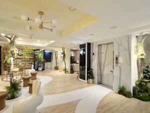 a lobby with plants on the walls and a ceiling at Finders Hotel Hualien Wen Hua in Hualien City +26 photos