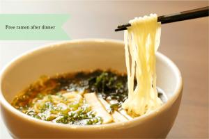 a bowl of soup with broccoli and noodles at La Vista Minami Aso Grand opening October 2nd 2026 in Minami Aso