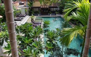 an overhead view of a swimming pool with palm trees at Indochine Serenity Boutique in Siem Reap