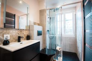 a bathroom with a sink and a glass shower at Chambre privative Dives Cabourg in Dives-sur-Mer +13 photos