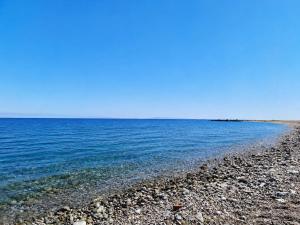 a rocky beach with the ocean in the background at Elegant Studio in Chios near the Beach and Port in Chios
