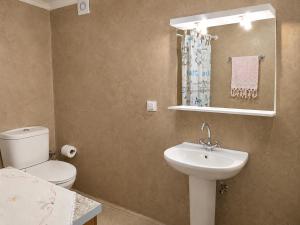 a bathroom with a sink and a toilet and a mirror at Elegant Studio in Chios near the Beach and Port in Chios