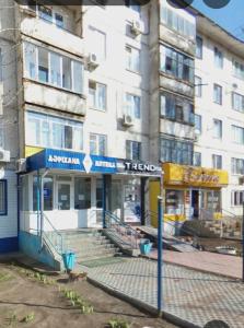 a building on a street in front of a building at Циолковского с кодовым замком in Oral
