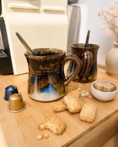 a wooden counter with a coffee cup and biscuits at Chambres d'hôte Casprese in Altiani +15 photos
