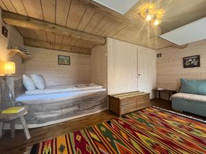 a bedroom with a large bed and a rug at Breb 220D in Breb +37 photos