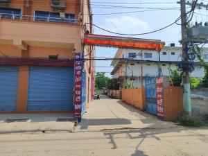 an alley with blue garage doors on a city street at Bindwasini Hotel And Party Palace in Bīrganj