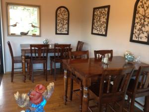 a wooden toy in a dining room with tables and chairs at Surf Inn in Gualala