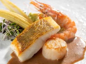 a plate of food with shrimp and corn on a table at Wan Wan Paradise Yatsugatake in Hokuto +32 photos