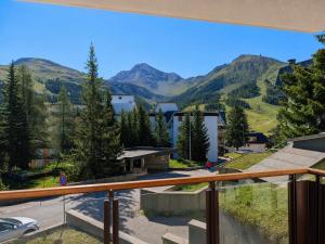 a view from a balcony with mountains in the background at Hostdomus - Good Vibes Apartment in Sestriere