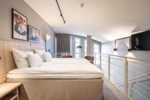a bedroom with a large bed in a room at Scandic Grand Marina in Helsinki +43 photos