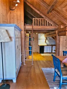 a bedroom with a bunk bed in a wooden cabin at DIRNDL Kammer in Abtenau