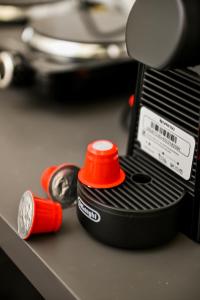 a close up of a red lid on a machine at Le Bel Appartement D'Antigoni in Alexandroupoli +28 photos