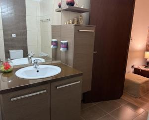 a bathroom with a sink and a mirror at Ta Spitakia tis Theodosias in Kalopanayiotis +48 photos