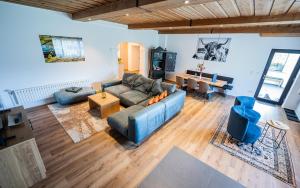 a living room with a couch and a table at Panorama Quartier Seefeld in Seefeld in Tirol