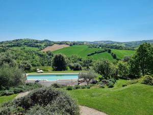 an image of a swimming pool in a green field at Casal dei Fichi in Francavilla dʼEte +72 photos