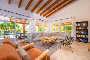 a living room with a couch and a table at Ca na Margalida in Manacor