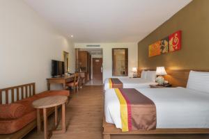 a hotel room with two beds and a couch at Naithonburi Beach Resort in Nai Thon Beach +44 photos