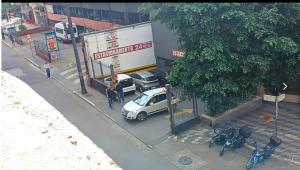 a car parked in front of a gas station at Aconchego em sampa in São Paulo