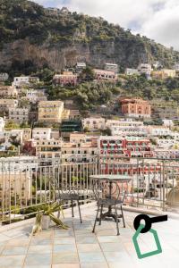 a view of a city from the roof of a building at Hotiday Positano Suites and View in Positano