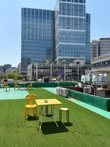 a table and chairs sitting on top of a roof at Stay Everyday in Seoul