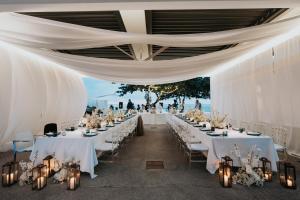 a wedding reception at the beach with white tables and chairs at Kata Rocks in Kata Beach +239 photos
