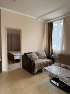 a bedroom with two beds and a window at Hayrapetyan Apartment Goris in Goris