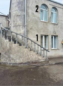 a stair case in front of a building at Hayrapetyan Apartment Goris in Goris