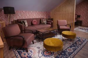 a living room with a couch and chairs and a table at Dom pod Niebem in Lucimia +52 photos