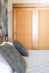 a bedroom with a bed with two pillows on it at Hotel Baia di Talamone in Talamone