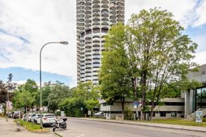 a tall building on a city street with a scooter at Global Bnb - Loft 28 Blue in Augsburg