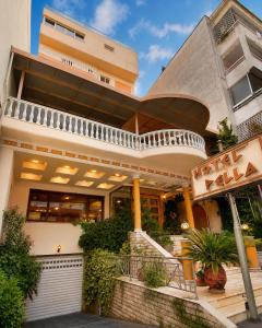 a building with a restaurant in front of it at Hotel Pella in Giannitsa