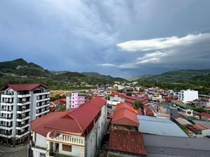 a view of a city with buildings and mountains at ANH ANH HOTEL in Bắc Hà