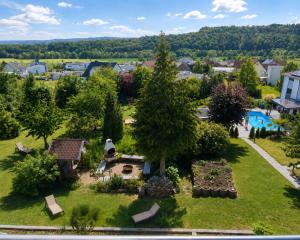 an aerial view of a park with a pool at Pension Höchemer in Bad Bocklet +101 photos