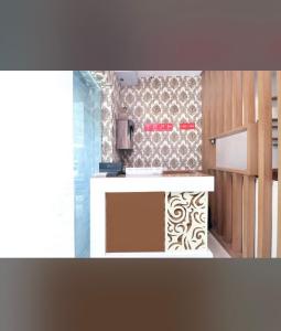 a kitchen with a sink and a counter top at FB Hotel in Kharar