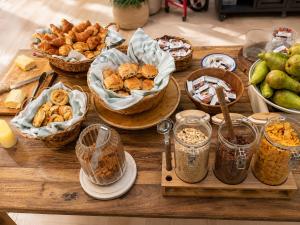 a table topped with baskets of bread and other foods at LATROUPE Grand Place in Brussels