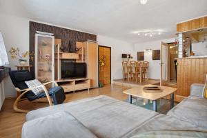 a living room with a couch and a table at Ferienwohnung Hundefreundlich 70 qm in Barth
