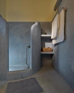 a bathroom with a shower with a glass door at Sea Breeze in Otziás +42 photos