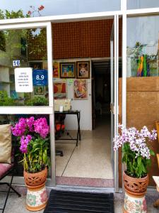 a store with two vases with flowers in it at View Talay 1B Holidays in Pattaya South