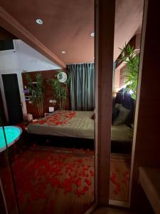 a bedroom with a bed and a tub in it at Ama Collection Esclusive Spa in Bologna +43 photos