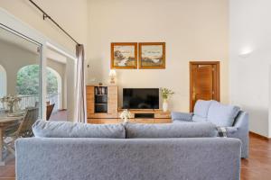 a living room with two couches and a tv at SolParc 589 by 3VILLAS in Son Parc