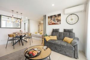 a living room with a couch and a table at Infinity Summer in San Miguel de Abona
