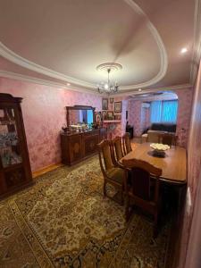 a dining room with a table and chairs in a room at there is no a name in Itʼkhvisi