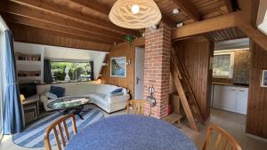 a living room with a couch and a table at Casa Ines in Brezzo