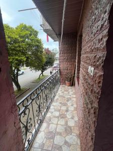 a balcony of a building with a iron fence at there is no a name in Itʼkhvisi +2 photos