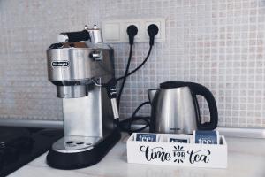 a coffee maker sitting on a counter next to a mixer at Hvar beach vacation in Vrboska