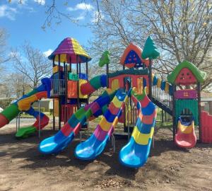 a playground with a colorful slide and a slideintend at Mobil home Privilège 2 in Vaux-sur-Mer