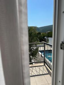 a view of a swimming pool from a balcony at Kuća za odmor Nina in Čapljina